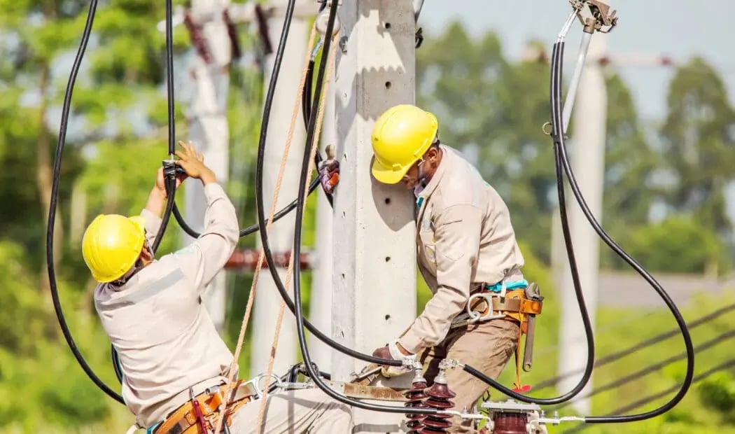 utilities workers working on site with electricity cables