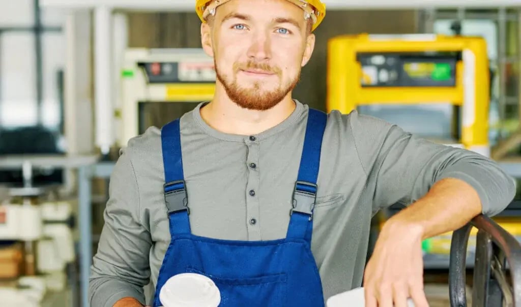 factory worker wearing protective headgear factory worker wearing protective headgear
