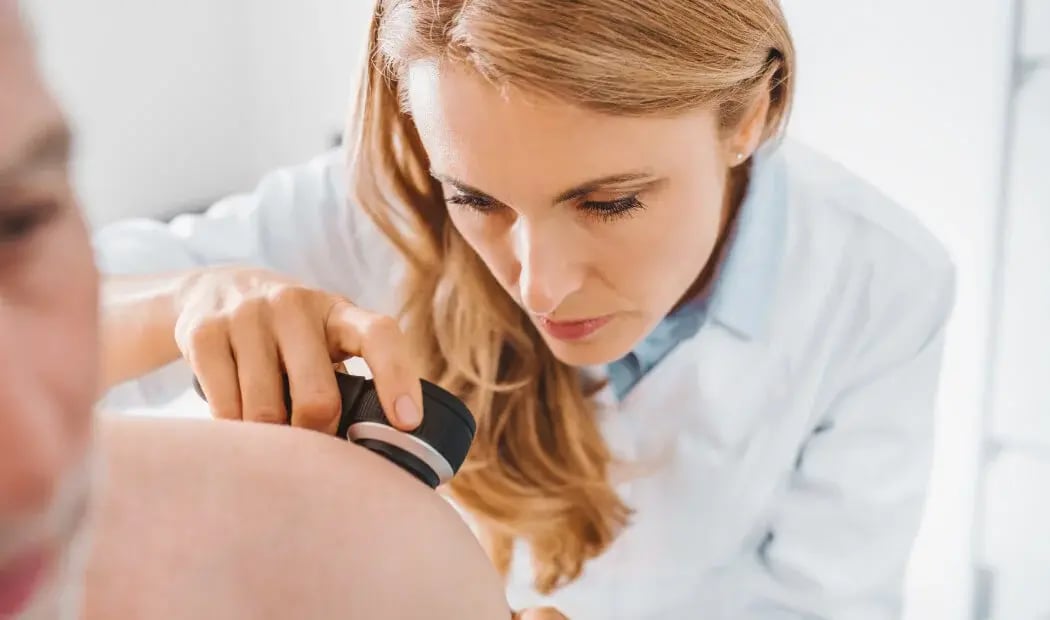 a specialist conducting a skin check
