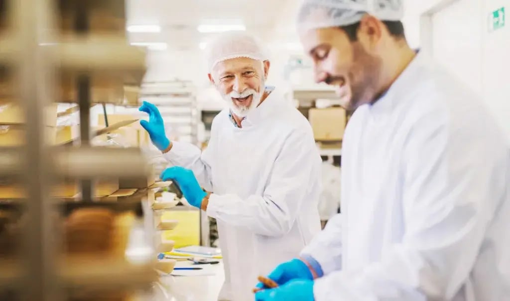Product Makers employees wearing protective gear and latex gloves