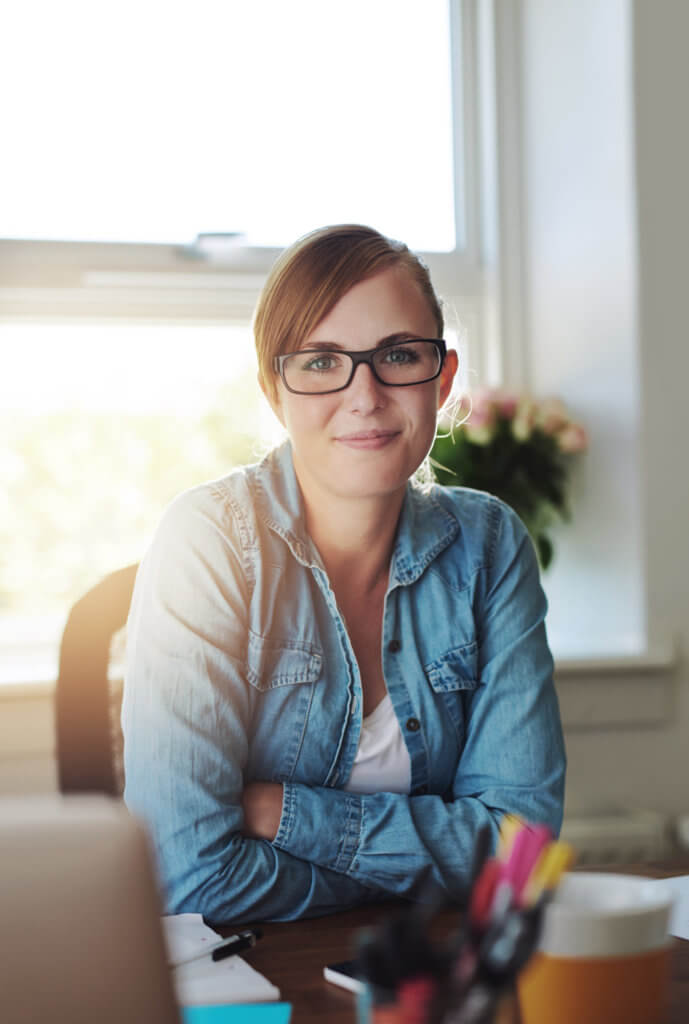 young female office worker at a desk