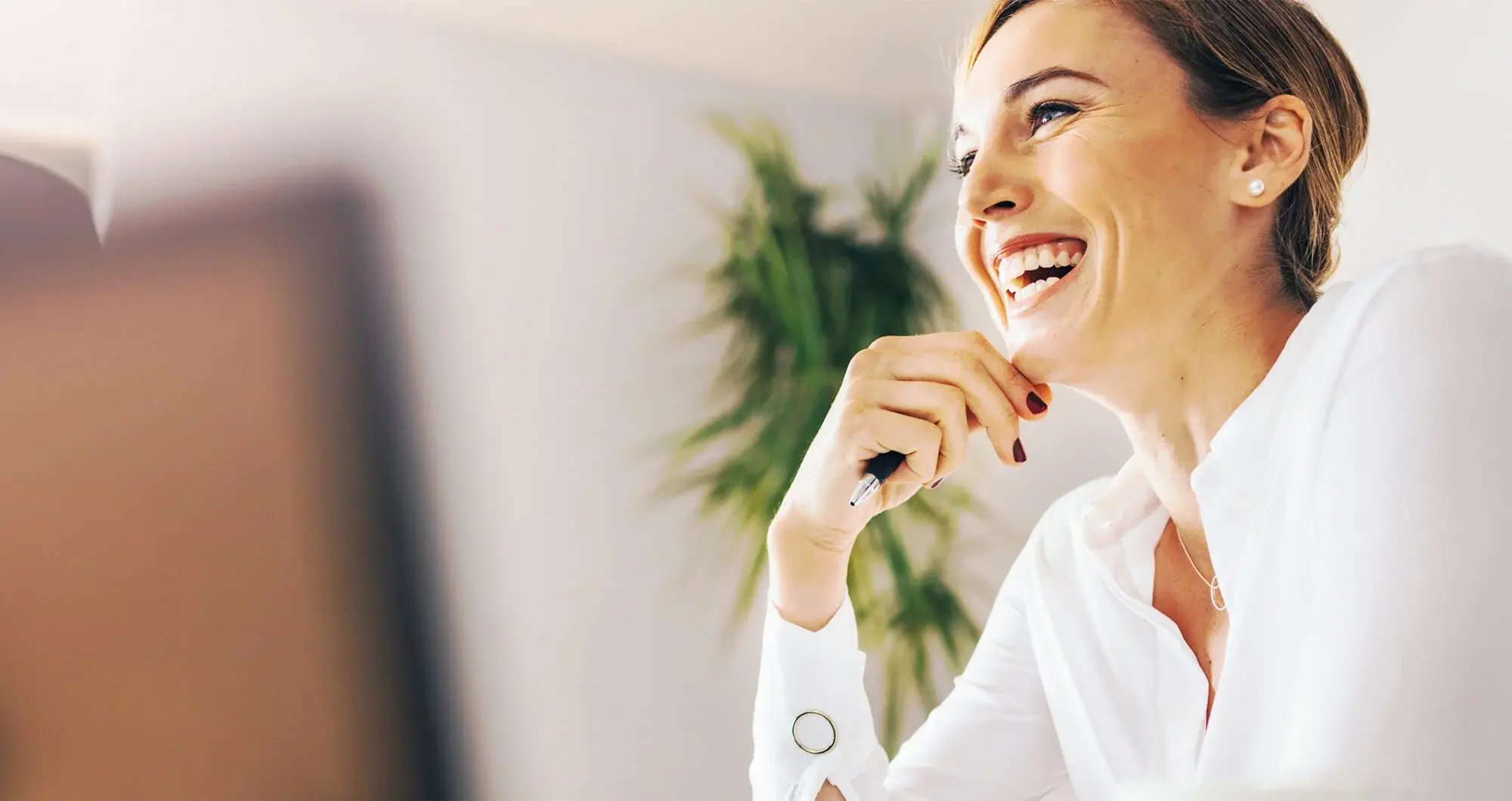 A financial services professional woman smiling