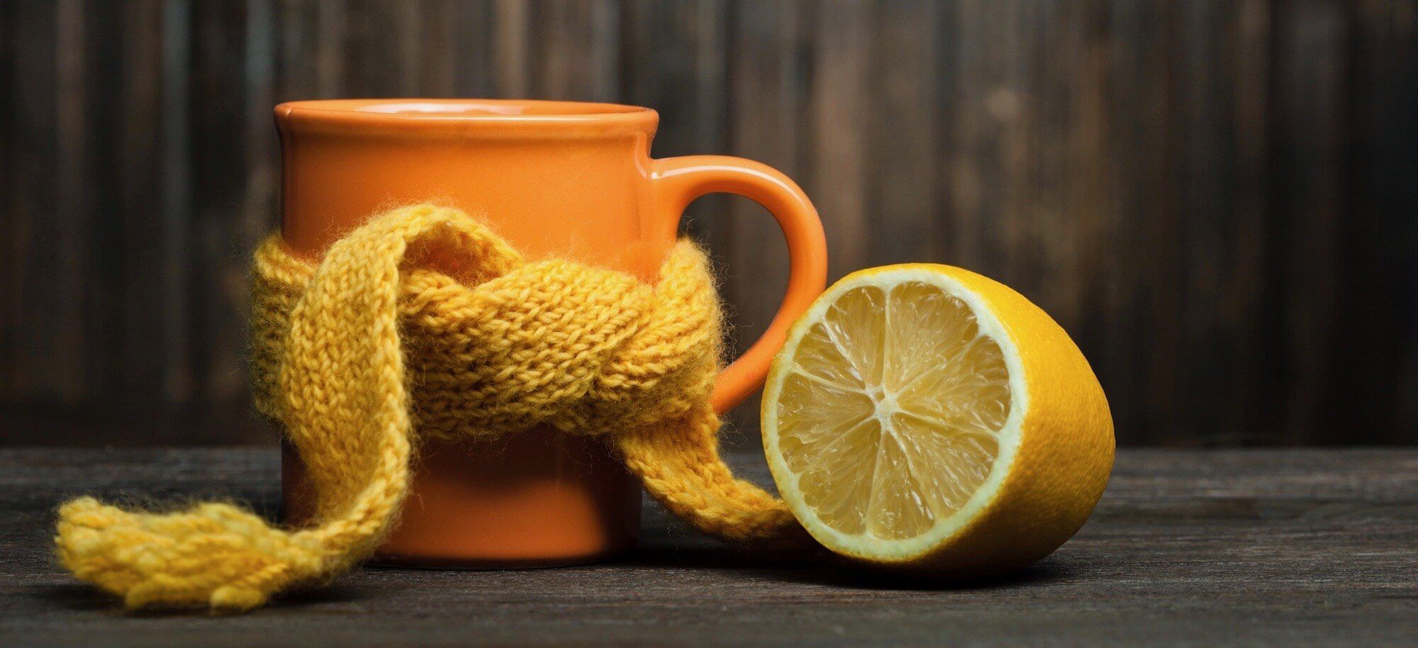 sliced lemon with a cup
